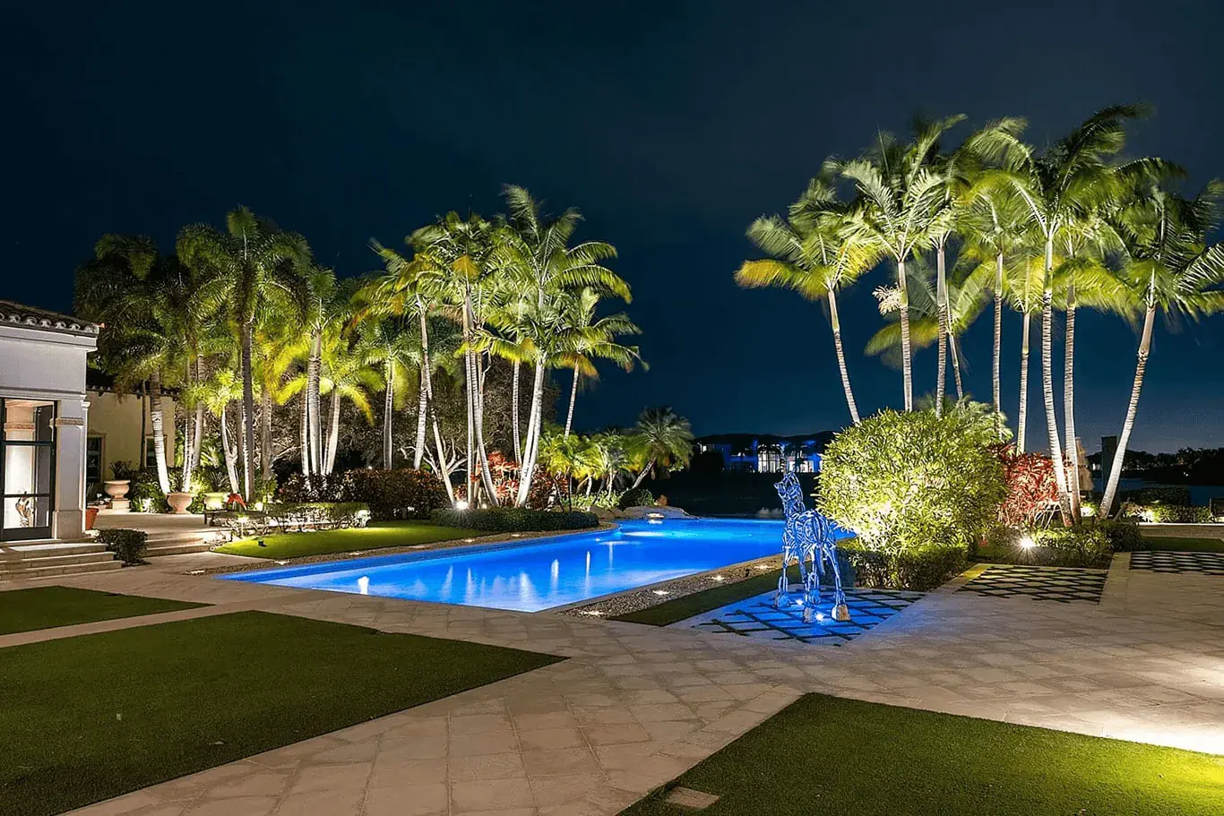 Landscape lighting highlighting mature trees and natural textures